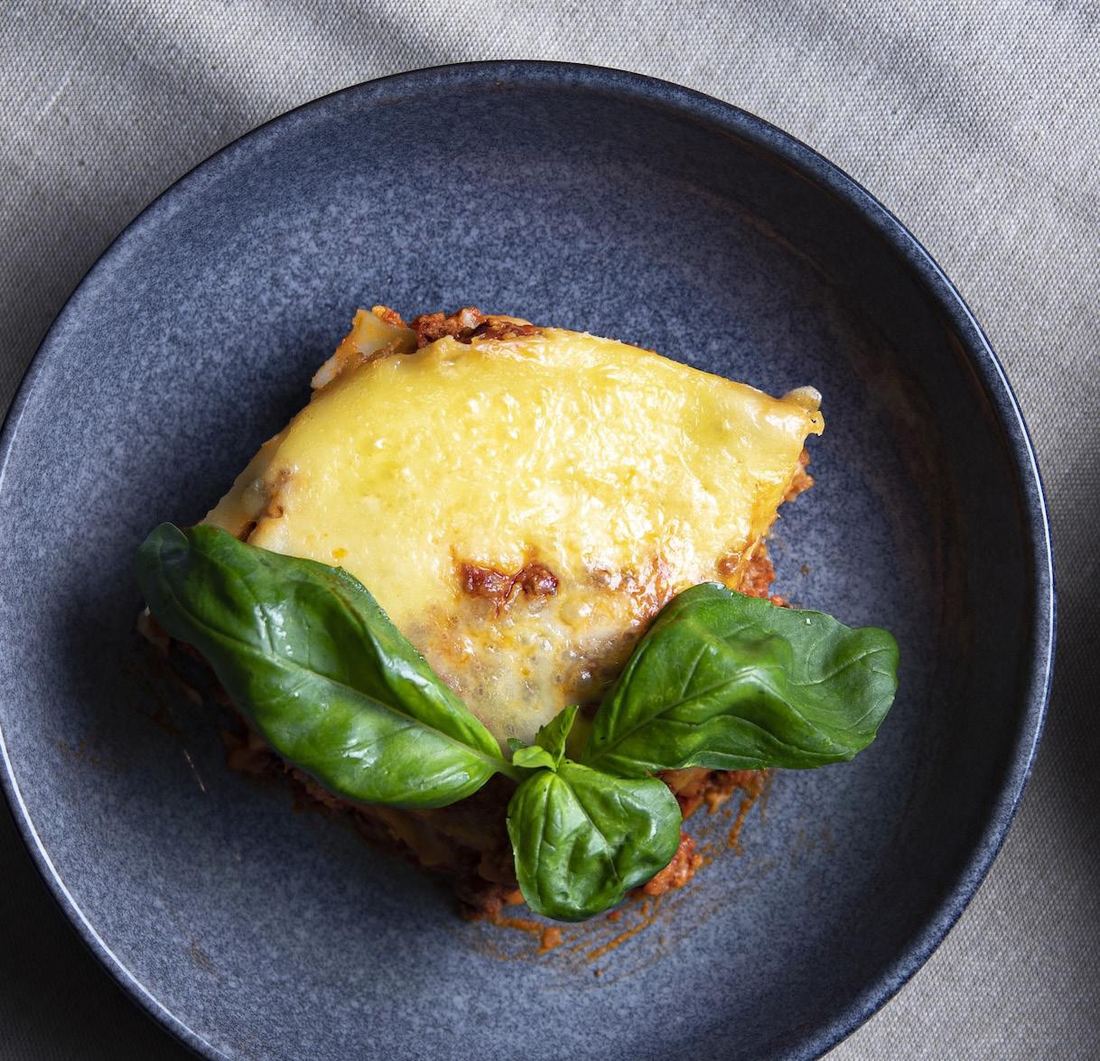 A serve of Chatham beef lasagna topped with fresh basil