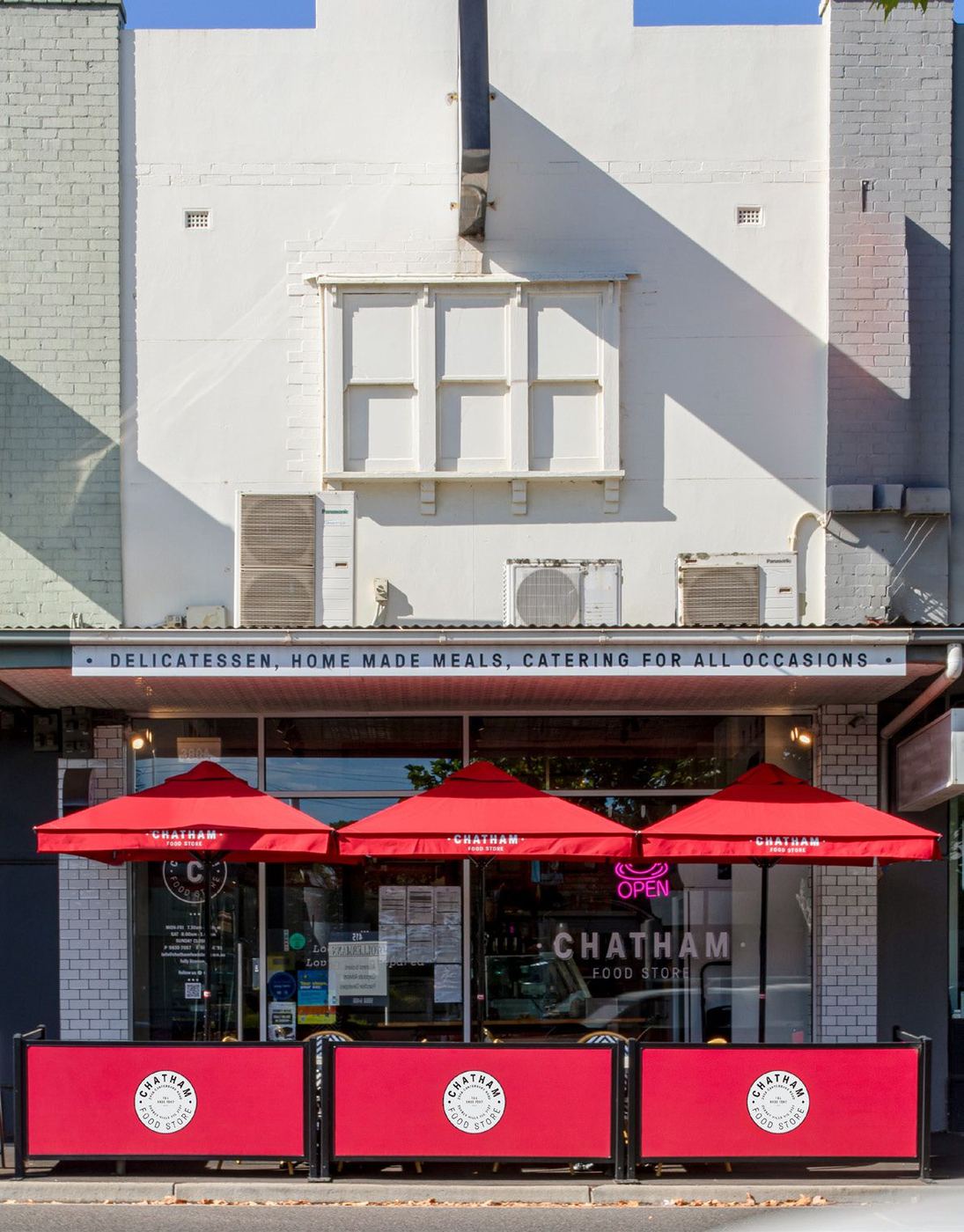 Chatham Food Store shopfront on Canterbury Road with its red umbrellas